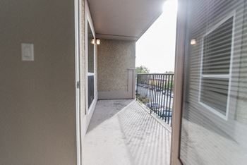 The view of the balcony from the living room of an apartment